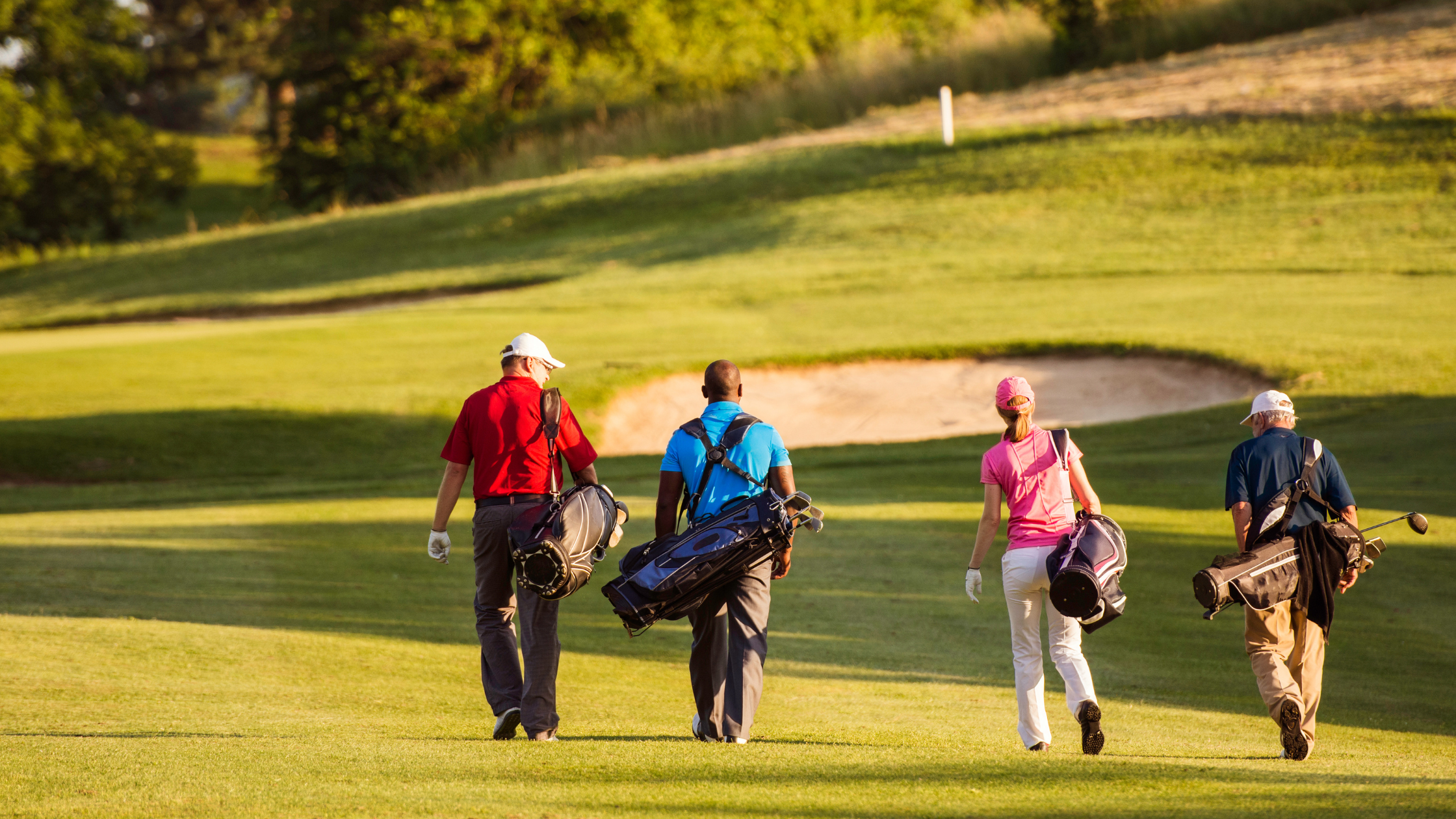 Golfers walking on a golf course