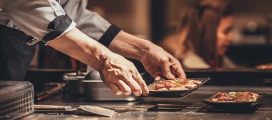 a man keeping dishes on the table