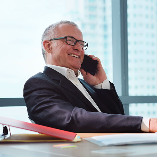 man talking on the phone and smiling